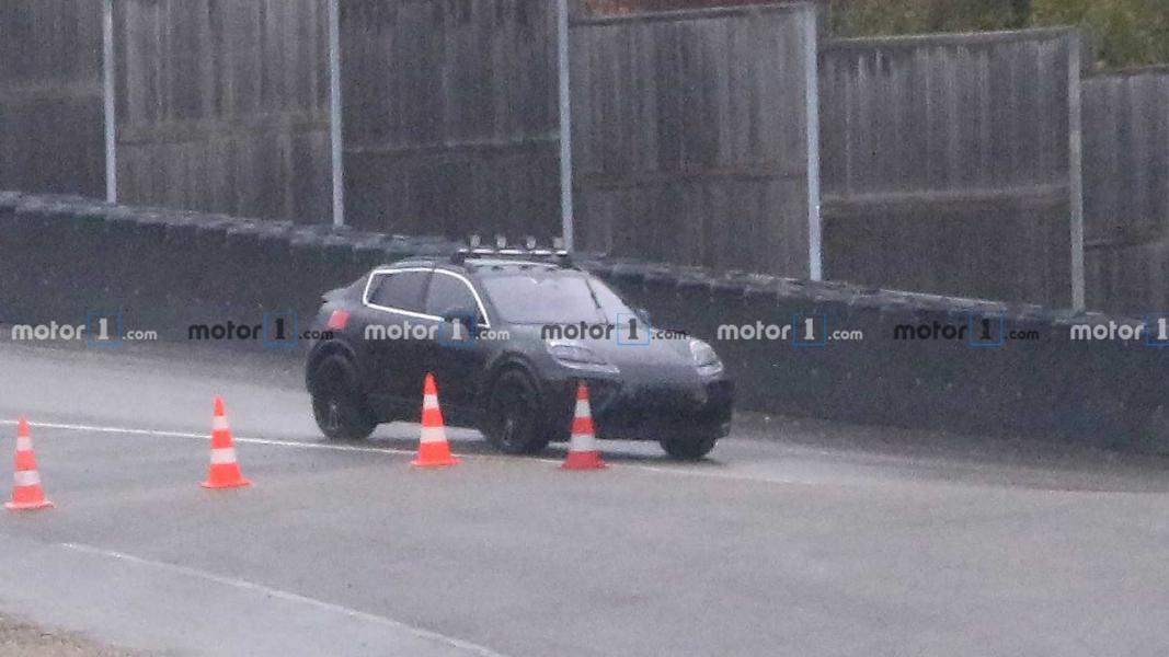 2022-porsche-macan-electric-first-spy-photo-front-three-quarters-2