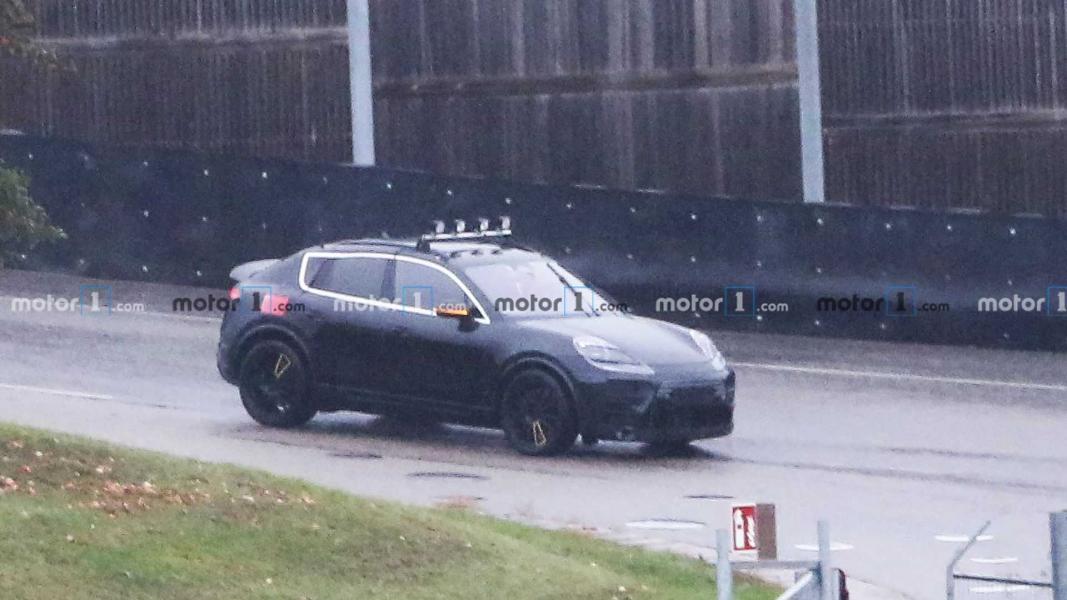 2022-porsche-macan-electric-first-spy-photo-front-three-quarters