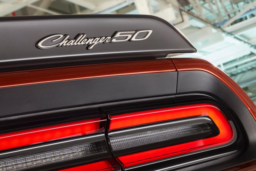 Challenger 50th Anniversary logo badges appear on the grille and spoiler in new "Gold School" finish on Challenger 50th Anniversary Edition models.