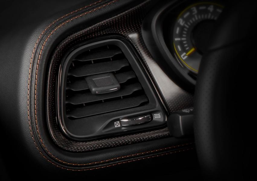 Challenger 50th Anniversary Edition models receive a real carbon fiber IP and console bezels with a copper weave.