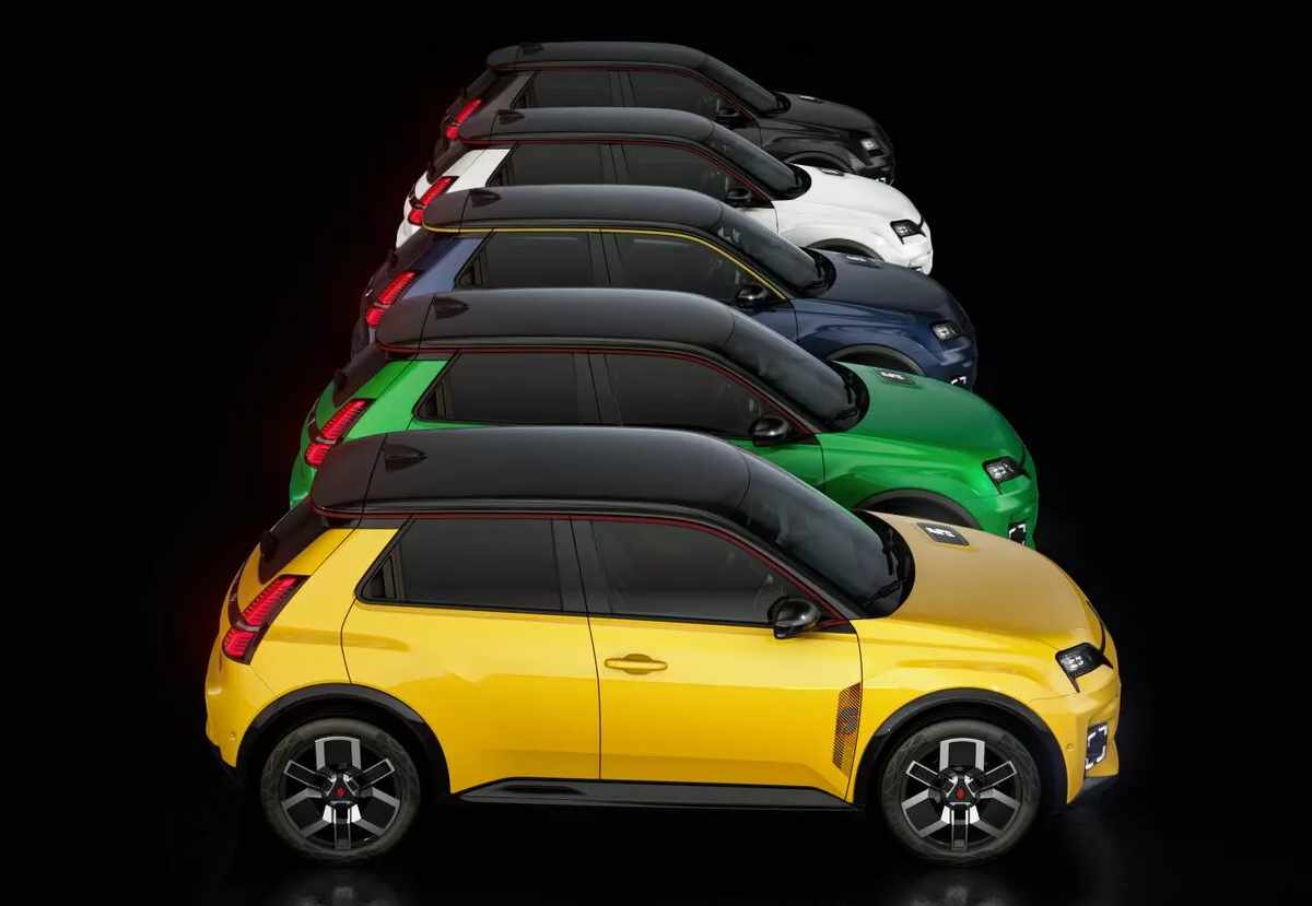 Fotografía de estudio oficial que exhibe cinco unidades del Renault 5 E-Tech estacionadas en lateral, mostrando su vibrante paleta de colores disponibles: amarillo, verde, azul oscuro, blanco perlado y negro medianoche, todos con el techo oscuro contrastante.