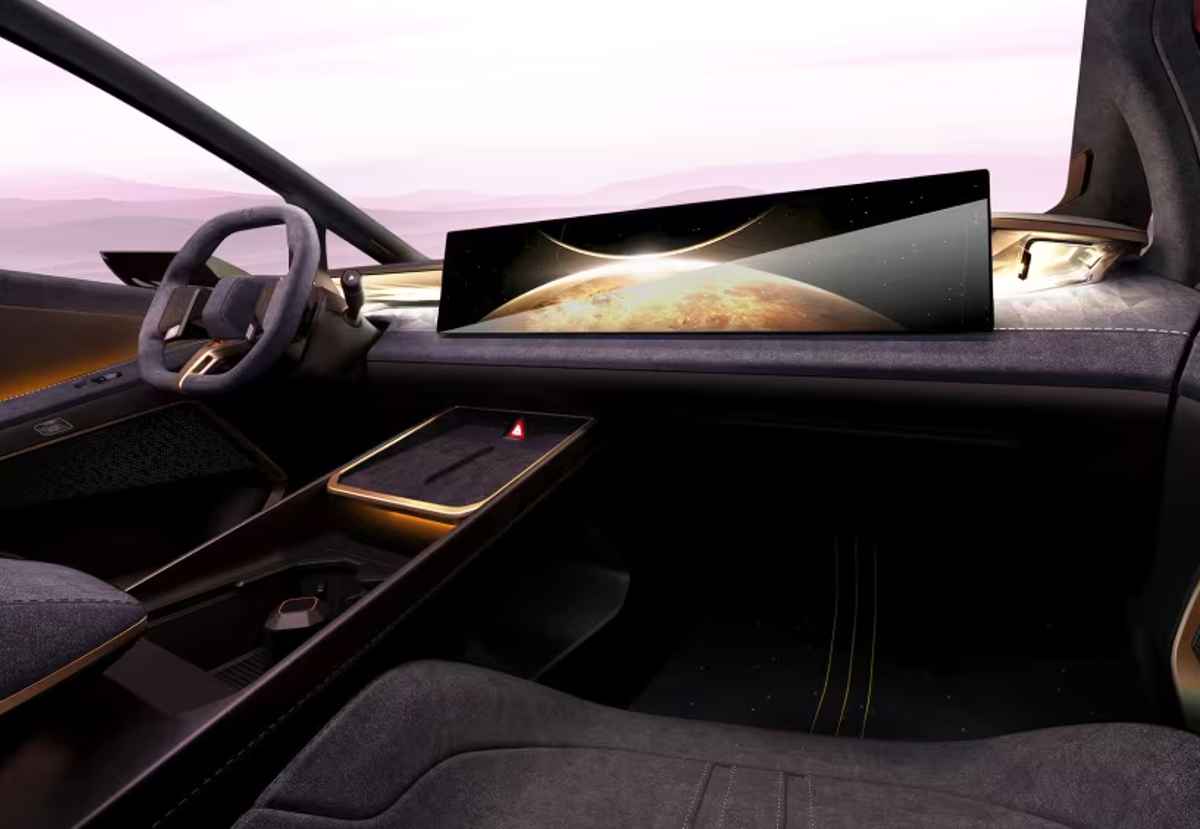 Diseño interior digitalizado de la cabina del Hyundai Ioniq V (Hyundai Venus Concept). El tablero es dominado por una enorme pantalla panorámica ultradelgada que proyecta la imagen de un planeta, acompañada de un volante minimalista y tapicería en materiales oscuros texturizados.