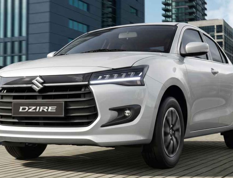Plano frontal en tres cuartos del sedán Suzuki Dzire con tecnología híbrida ligera en color blanco, uno de los carros que más bajó de precio en Colombia durante mayo.