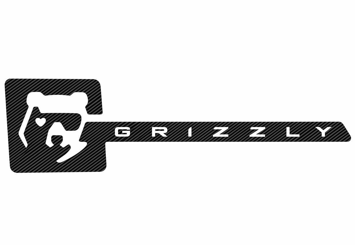 Logotipo oficial en blanco y negro del proyecto Fiat Grizzly, con la silueta estilizada de la cabeza de un oso grizzly junto a la tipografía del nombre del vehículo.