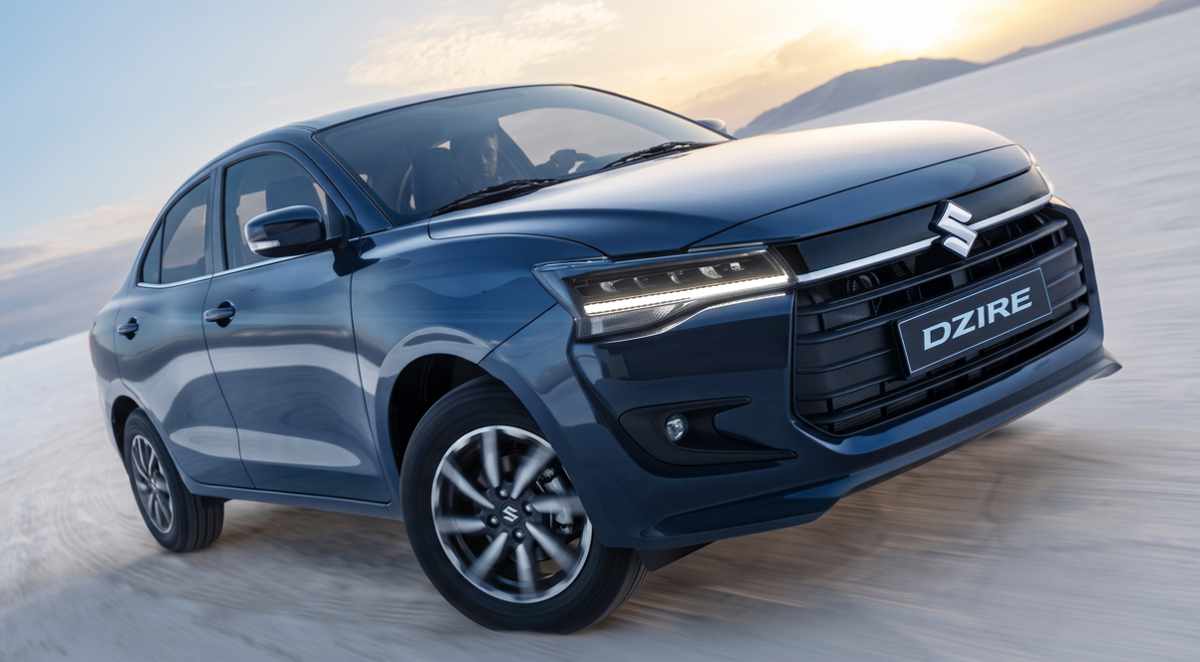 Suzuki Dzire color azul oscuro en movimiento por un paisaje desértico, destacando como uno de los sedanes más exitosos en ventas en Colombia durante junio de 2026.